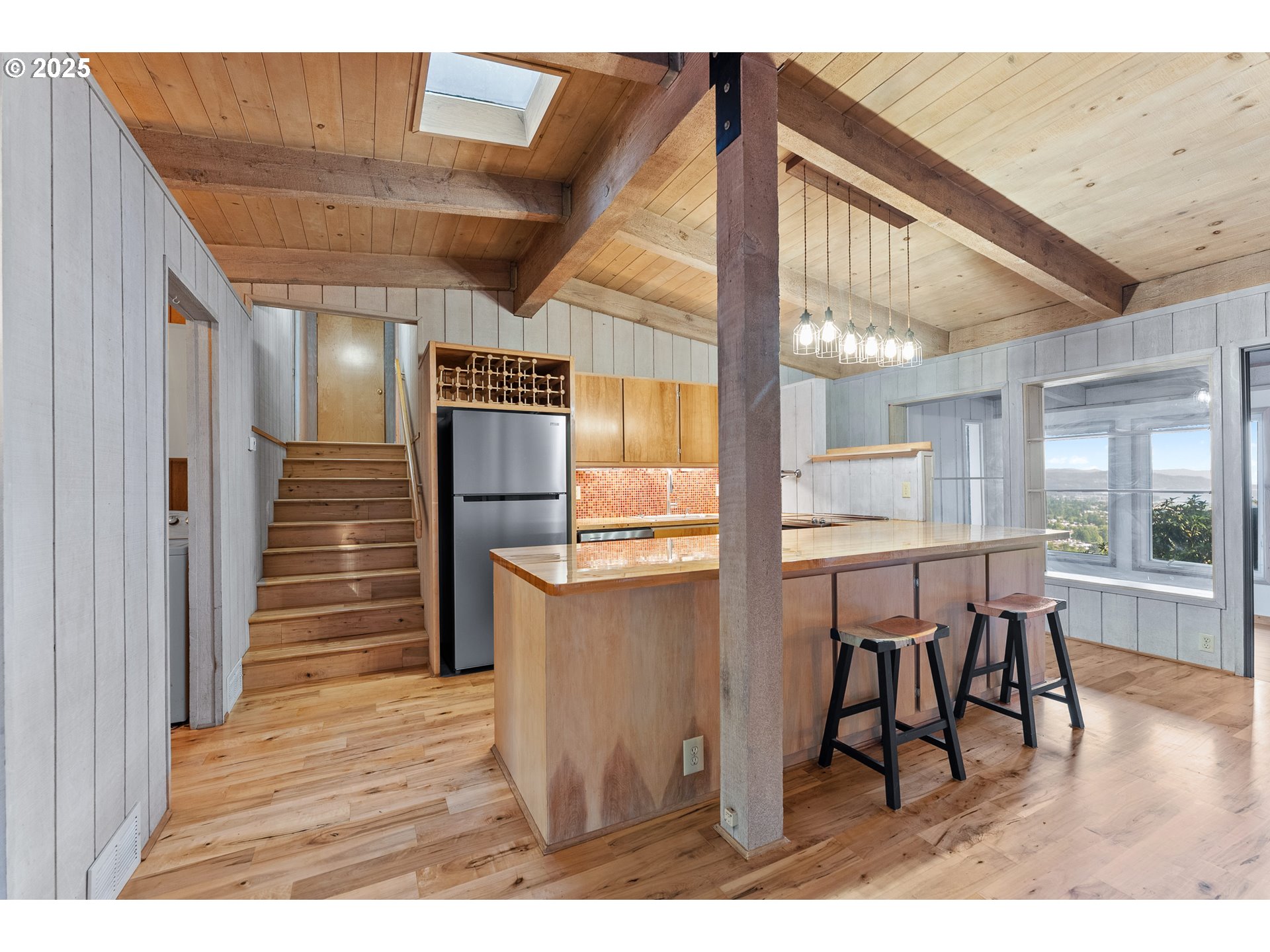97639 Marina Heights Loop Brookings, OR 97415 - Photo 5 of 27 a open kitchen with a table and chairs