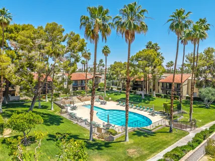 a view of a swimming pool with a garden