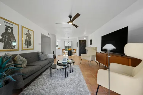 a view of a kitchen with dining area closet and windows
