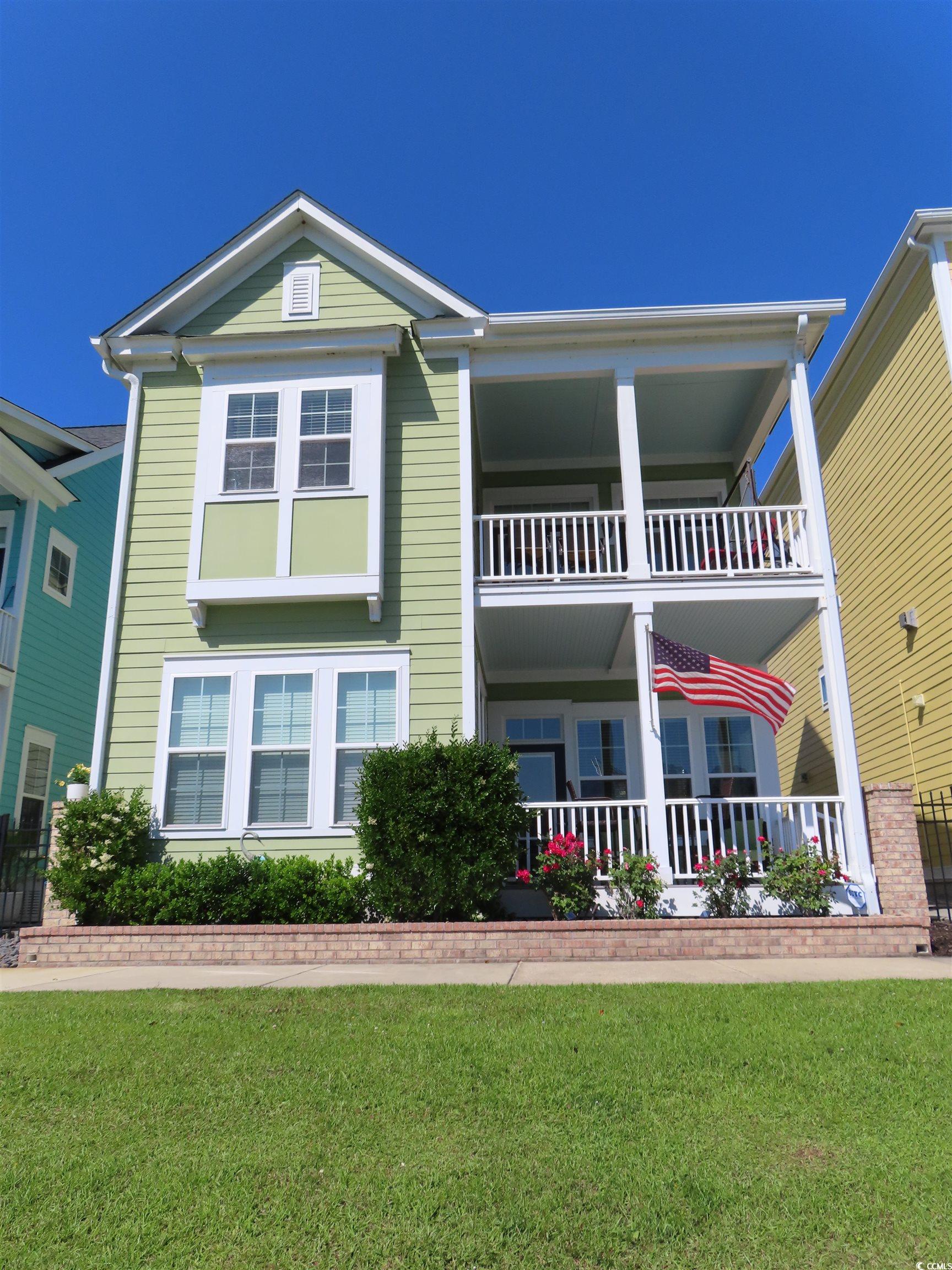 800 Curtis Brown Lane Myrtle Beach, SC 29577 - Photo 1 of 40 View of front facade with a front lawn and a porch