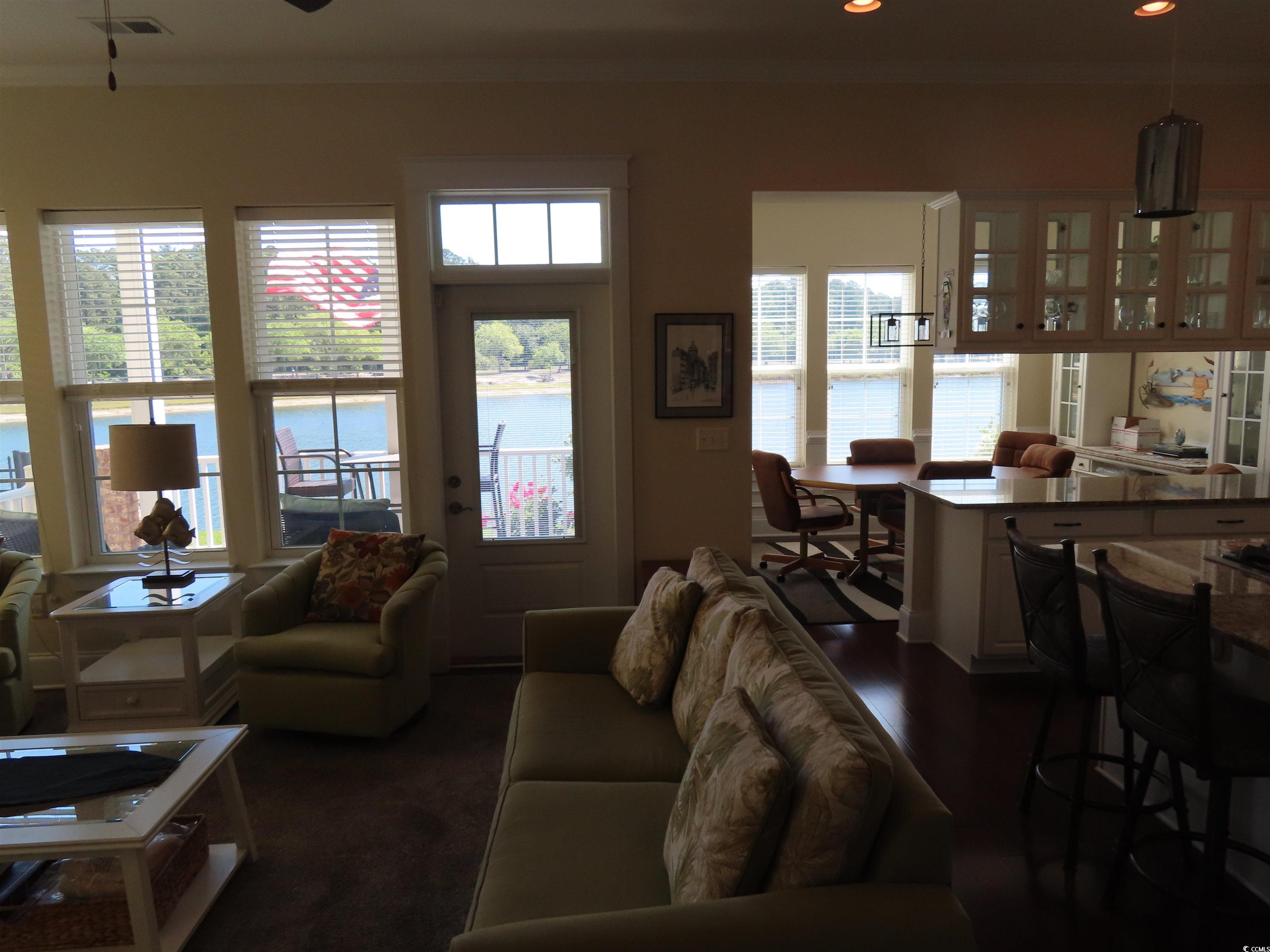 800 Curtis Brown Lane Myrtle Beach, SC 29577 - Photo 16 of 40 Living room featuring crown molding, a water view, recessed lighting, and a ceiling fan