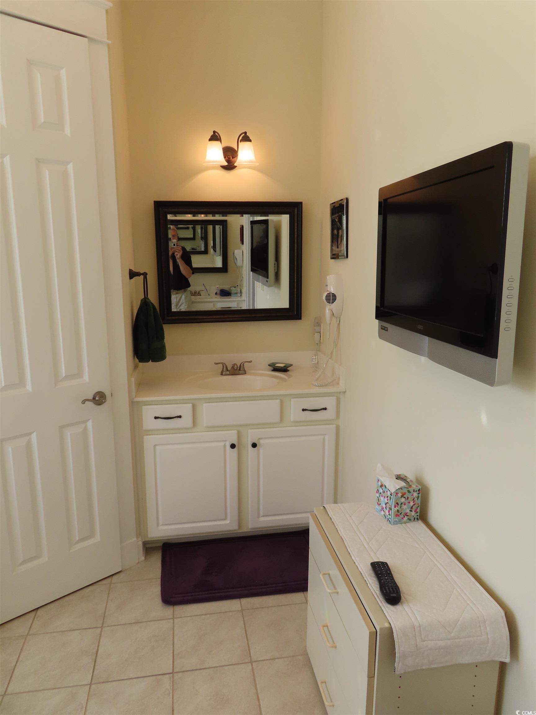800 Curtis Brown Lane Myrtle Beach, SC 29577 - Photo 26 of 40 Bathroom with light tile patterned floors and vanity