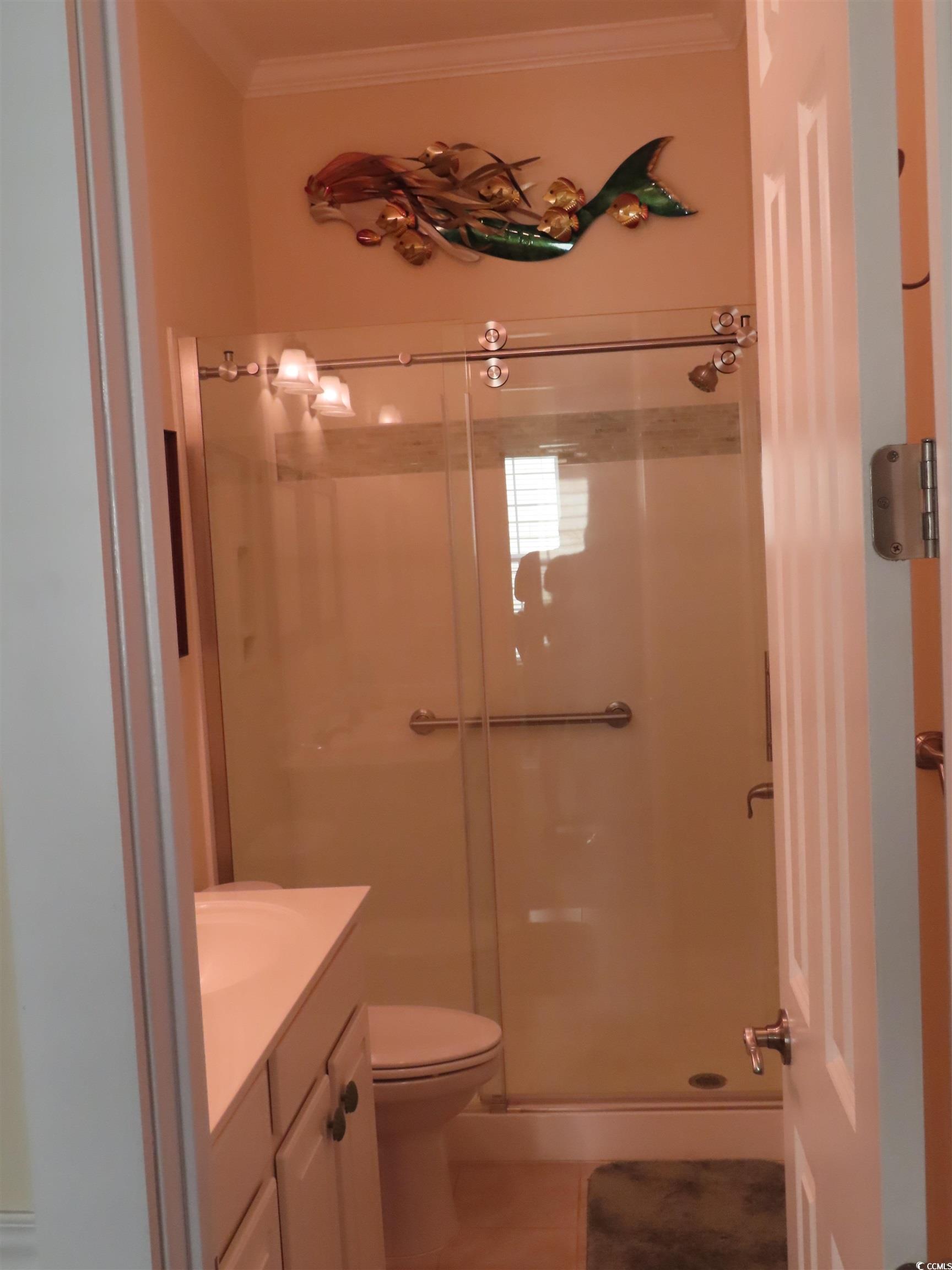 800 Curtis Brown Lane Myrtle Beach, SC 29577 - Photo 32 of 40 Full bath featuring a shower stall, vanity, tile patterned floors, and crown molding