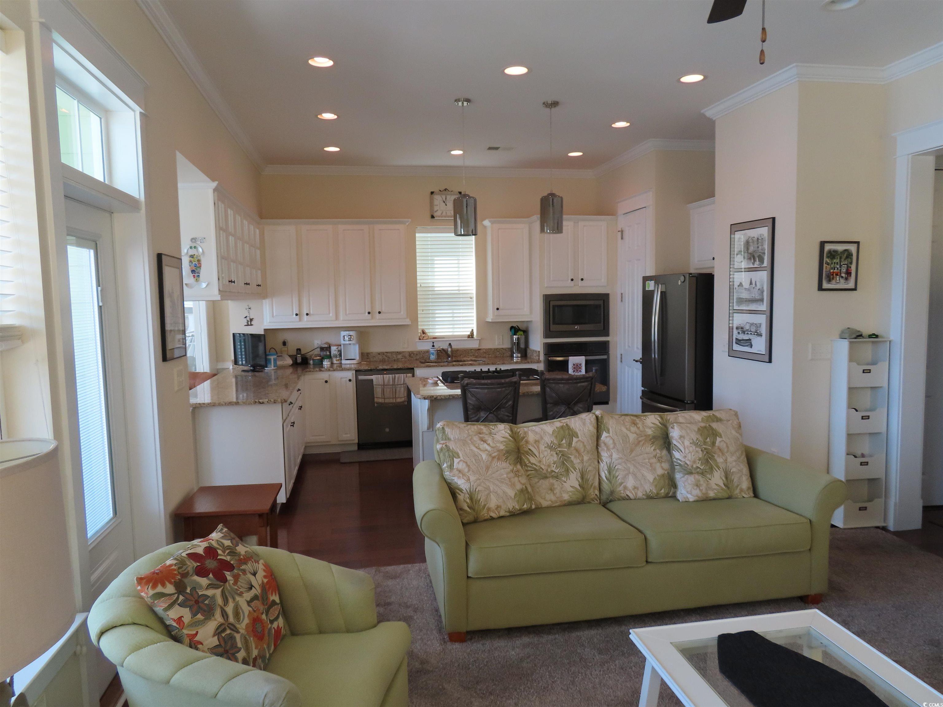 800 Curtis Brown Lane Myrtle Beach, SC 29577 - Photo 10 of 40 Living area featuring crown molding, recessed lighting, dark wood finished floors, and ceiling fan