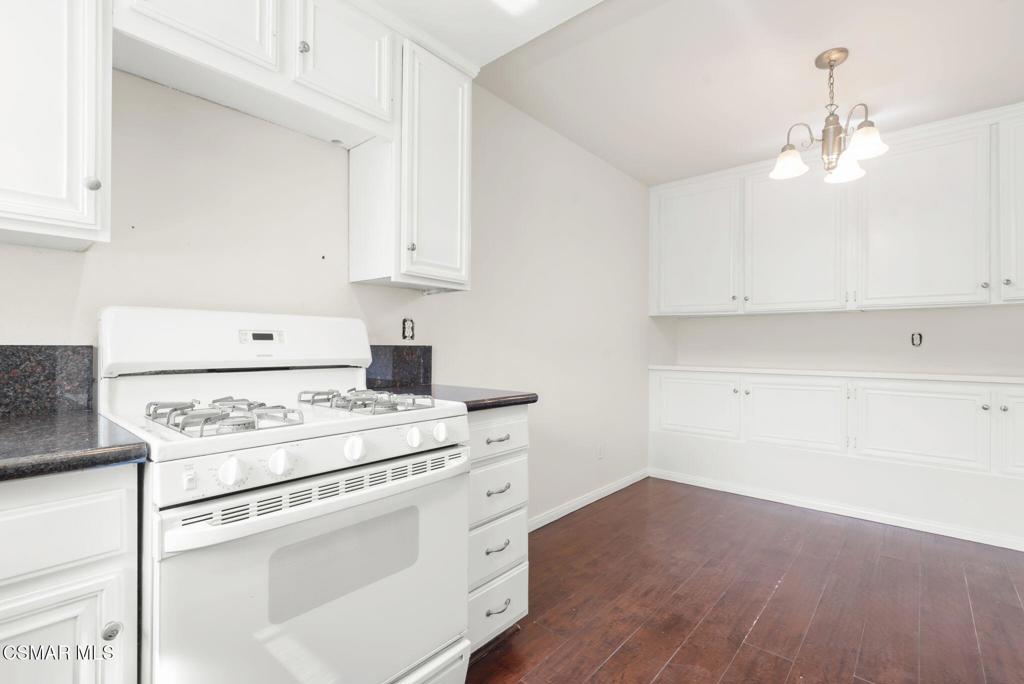 1258 Ramona Drive Newbury Park, CA 91320 - Photo 16 of 51 a kitchen with a stove a sink and a refrigerator