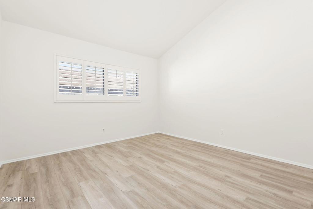 1258 Ramona Drive Newbury Park, CA 91320 - Photo 17 of 51 an empty room with wooden floor and windows