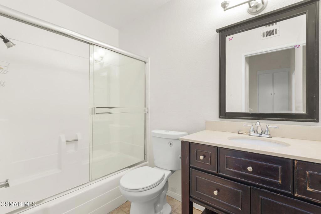 1258 Ramona Drive Newbury Park, CA 91320 - Photo 23 of 51 a bathroom with a sink a toilet a mirror and shower
