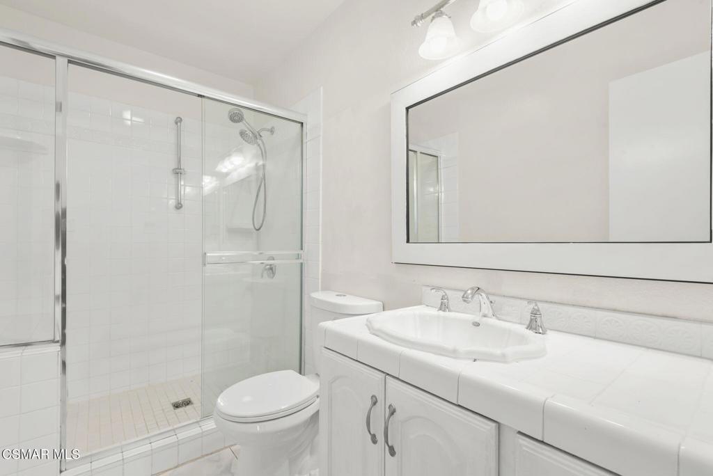 1258 Ramona Drive Newbury Park, CA 91320 - Photo 27 of 51 a bathroom with a sink toilet and shower