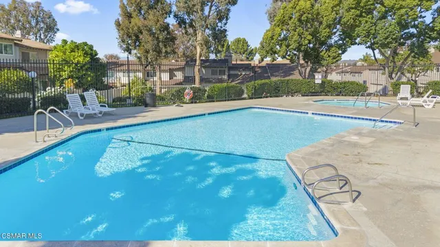 a view of a swimming pool with a patio