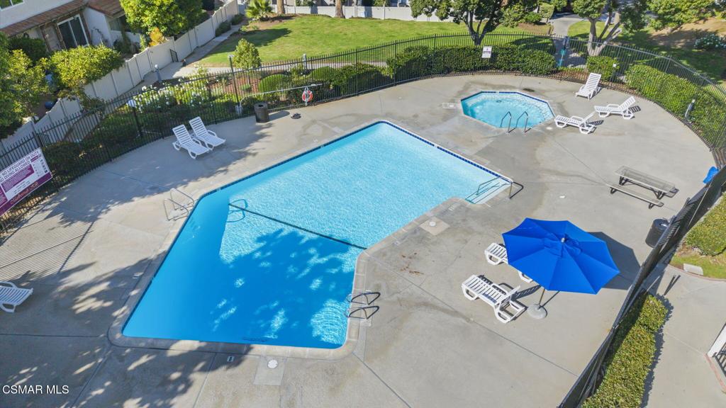 1258 Ramona Drive Newbury Park, CA 91320 - Photo 41 of 51 a view of a house with a yard and a garage