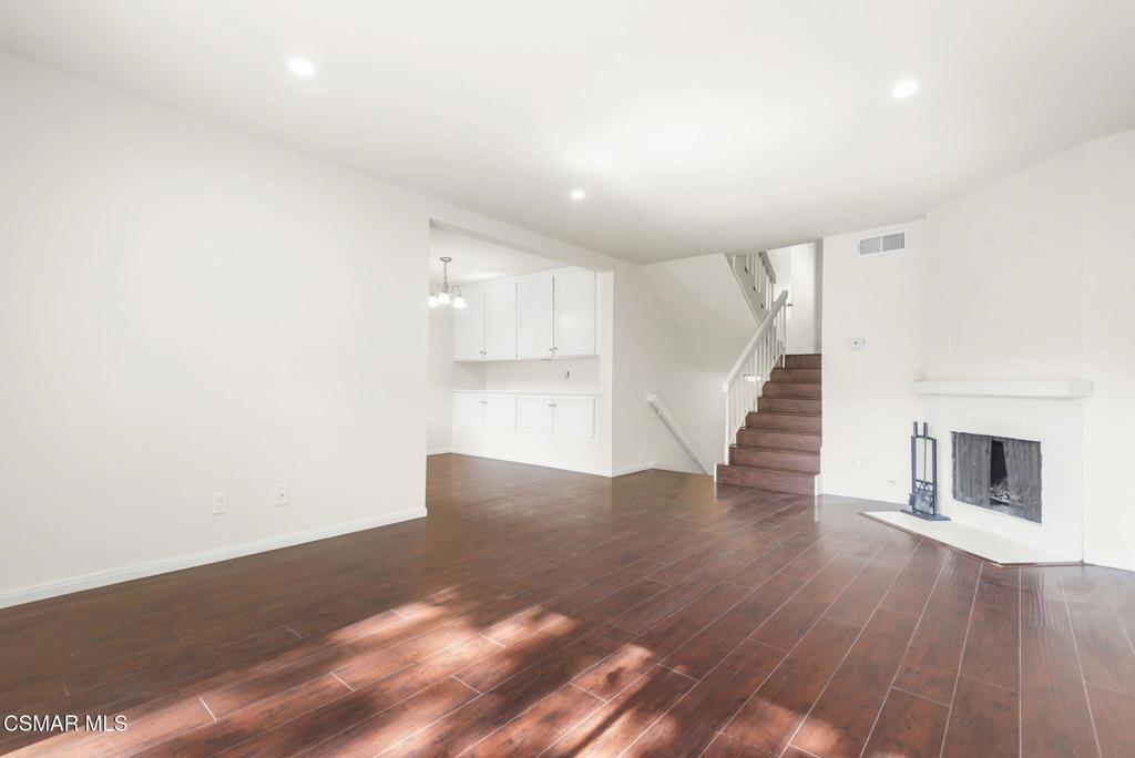 1258 Ramona Drive Newbury Park, CA 91320 - Photo 8 of 51 a view of a hallway with wooden floor and staircase