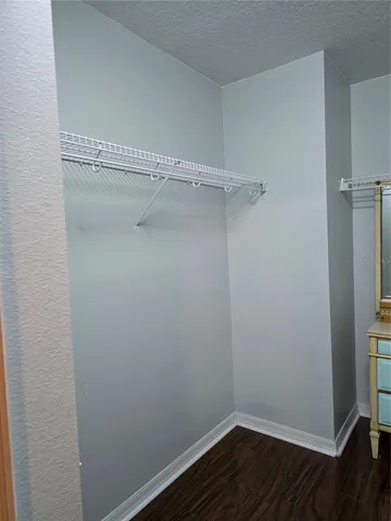 a view of an empty walk in closet