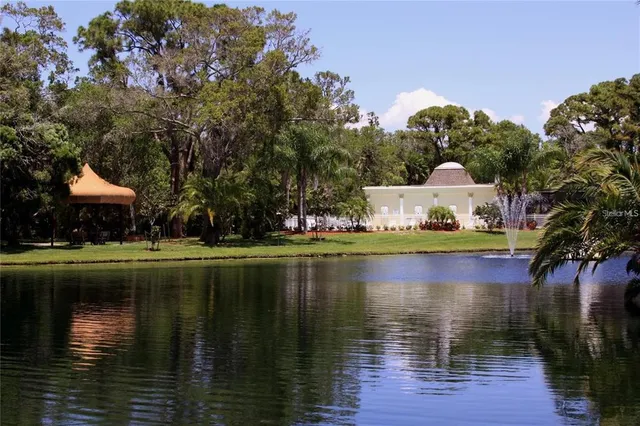 a large swimming pool with outdoor seating and yard