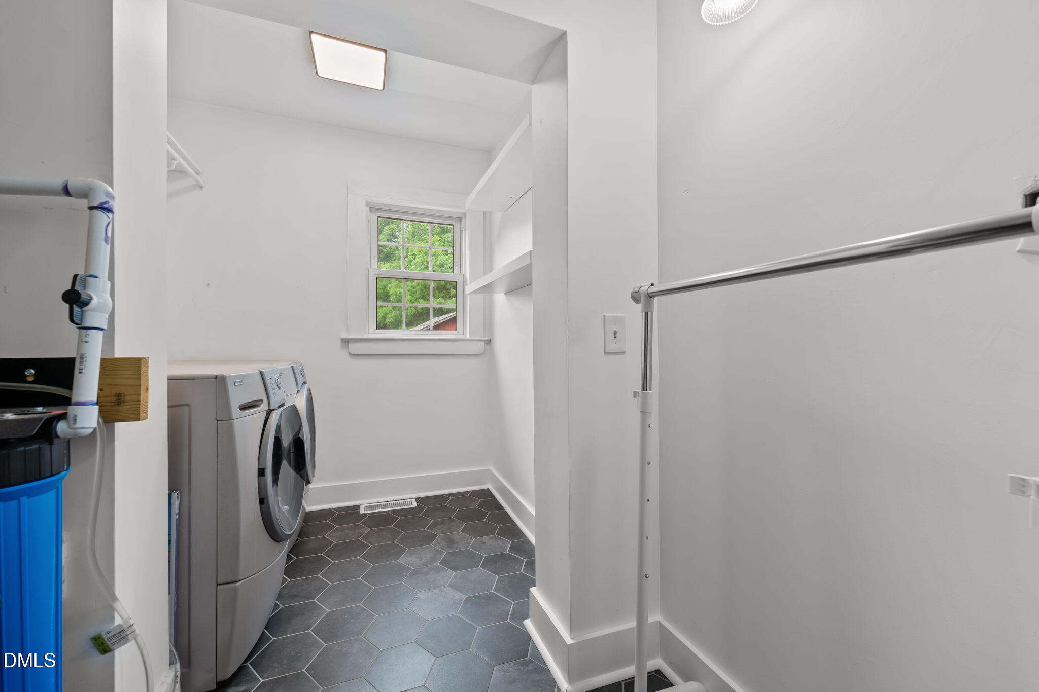 8718 Moody Road Liberty, NC 27298 - Photo 14 of 52 a view of storage and utility room with a washer and dryer