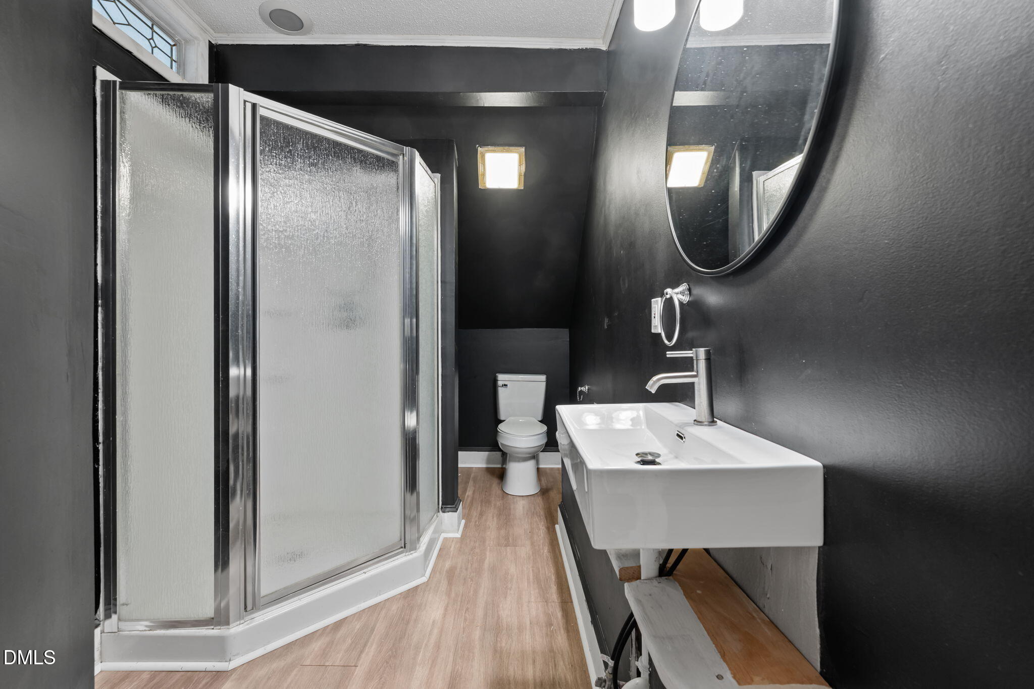 8718 Moody Road Liberty, NC 27298 - Photo 22 of 52 a bathroom with a mirror a sink and a mirror