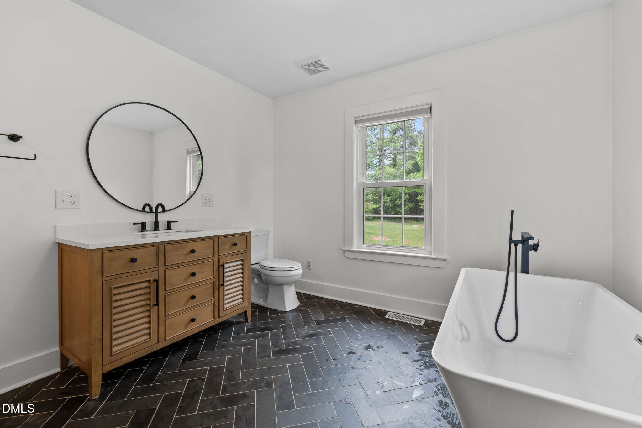 8718 Moody Road Liberty, NC 27298 - Photo 26 of 52 a bathroom with a sink and a mirror
