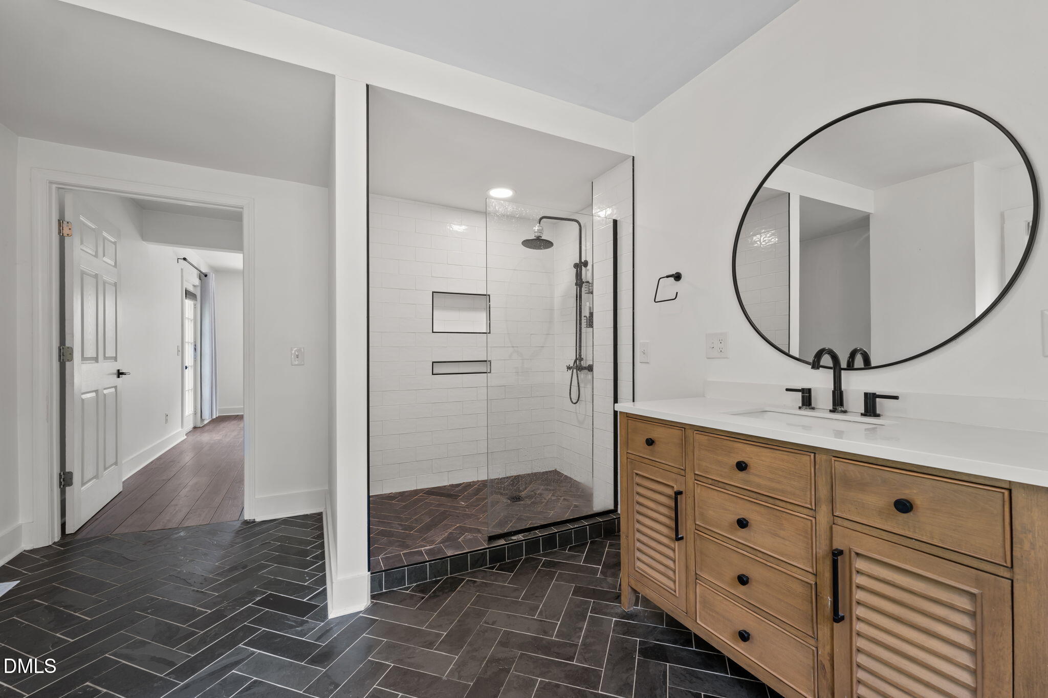 8718 Moody Road Liberty, NC 27298 - Photo 27 of 52 a bathroom with a sink a mirror and a shower