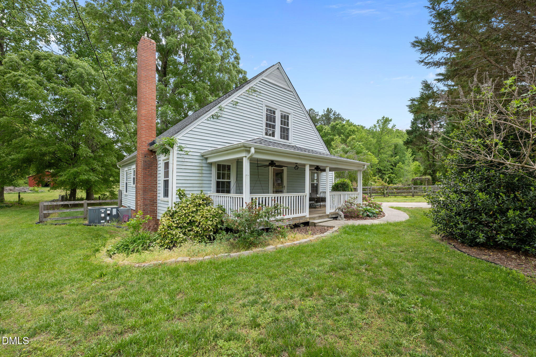 8718 Moody Road Liberty, NC 27298 - Photo 28 of 52 a view of backyard of house with wooden deck and seating space