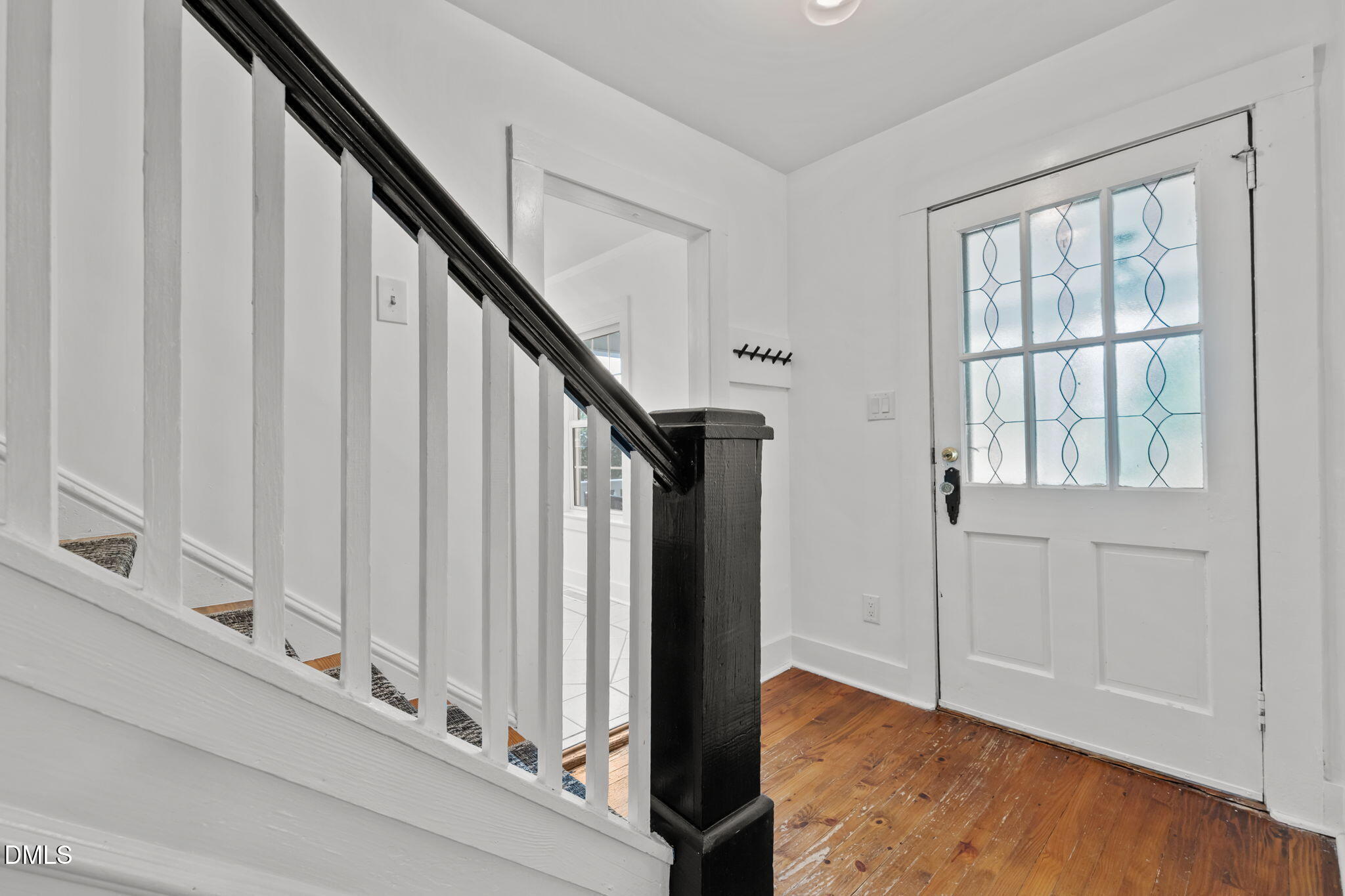 8718 Moody Road Liberty, NC 27298 - Photo 3 of 52 a view of an entryway with wooden floor and staircase