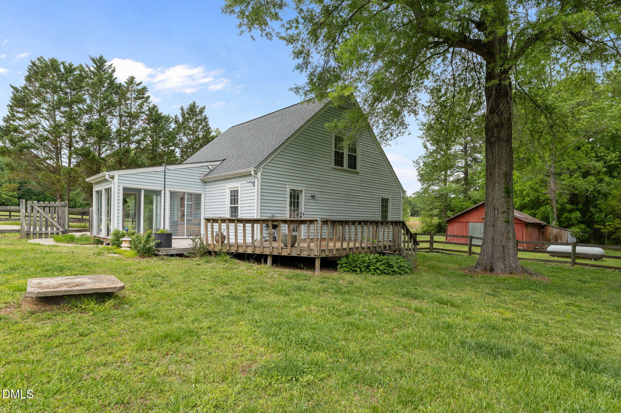 8718 Moody Road Liberty, NC 27298 - Photo 33 of 52 a view of a house with a yard and deck