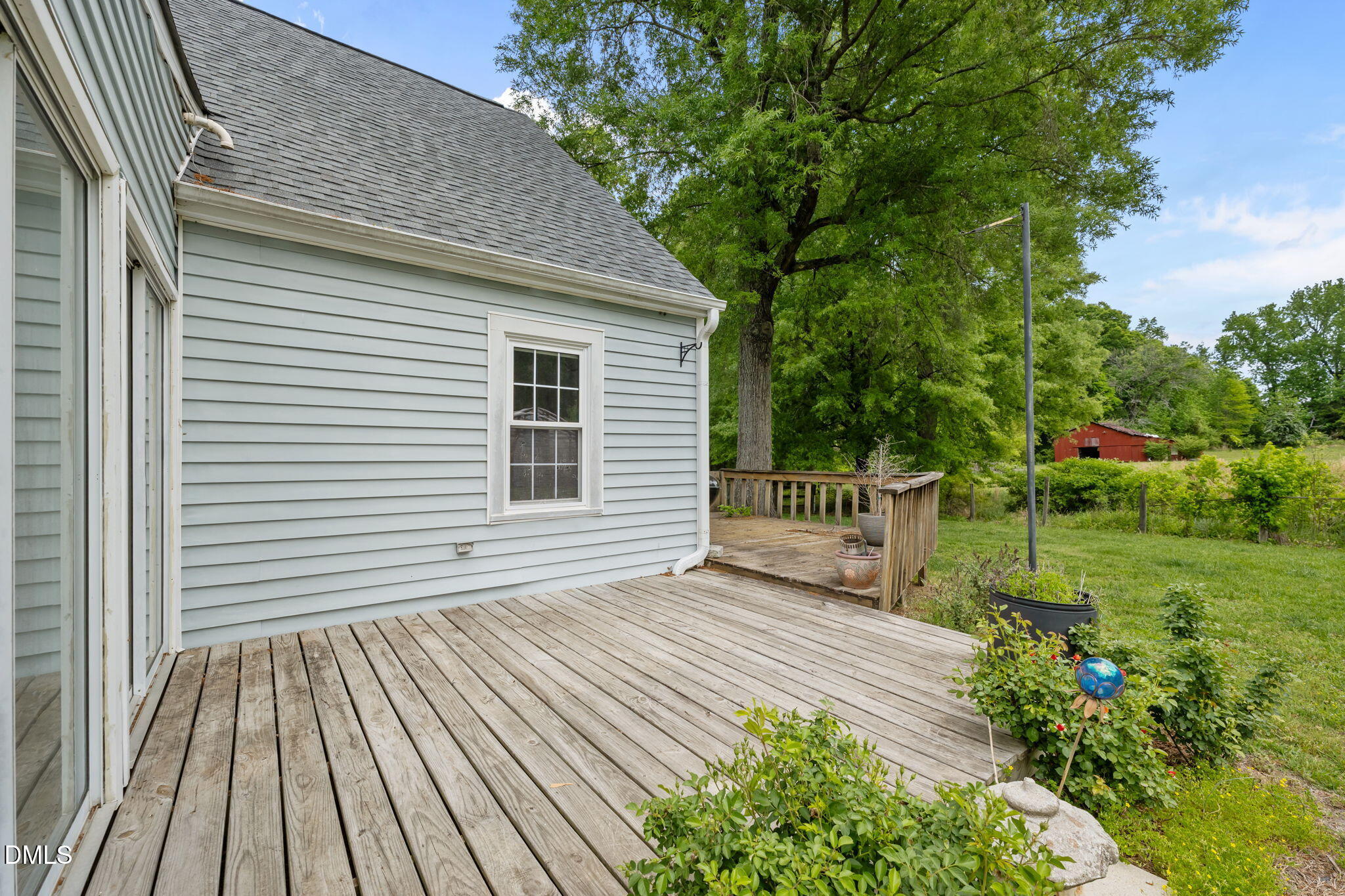 8718 Moody Road Liberty, NC 27298 - Photo 35 of 52 a view of a house with a yard