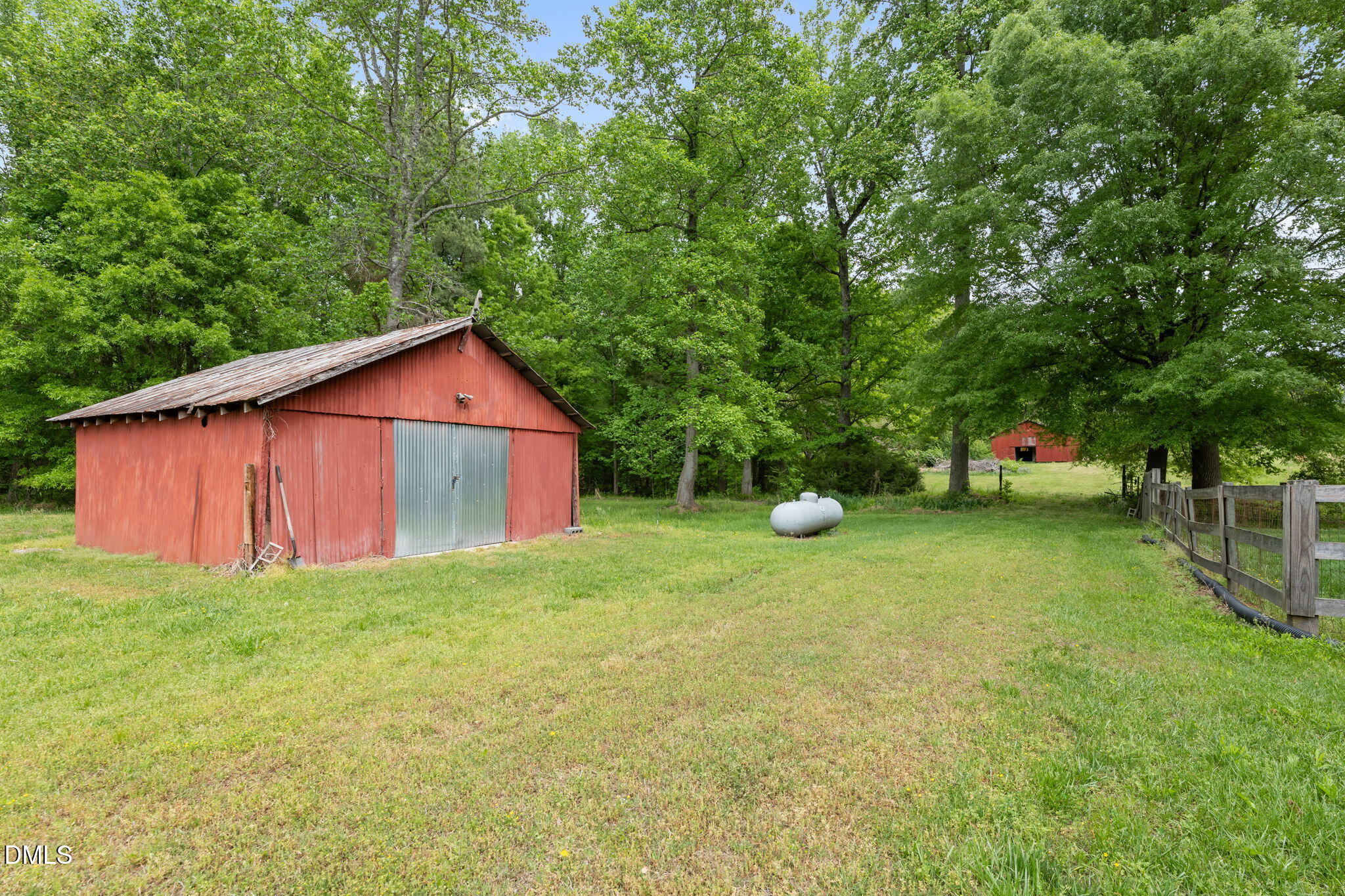 8718 Moody Road Liberty, NC 27298 - Photo 38 of 52 a view of an house with backyard space and garden