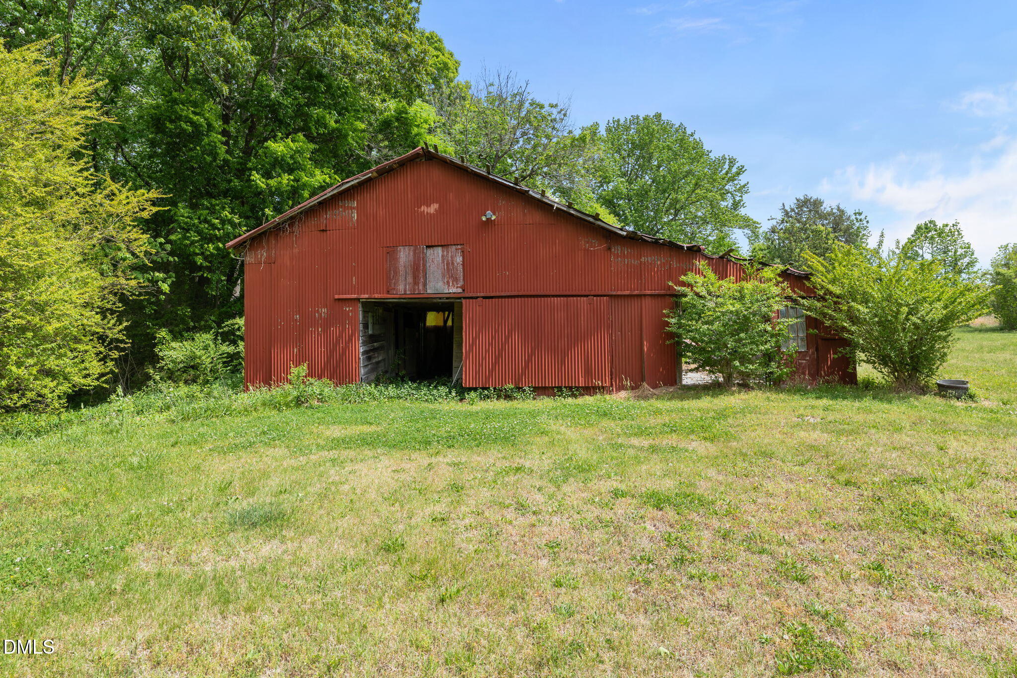 8718 Moody Road Liberty, NC 27298 - Photo 40 of 52 a backyard of a house with lots of green space