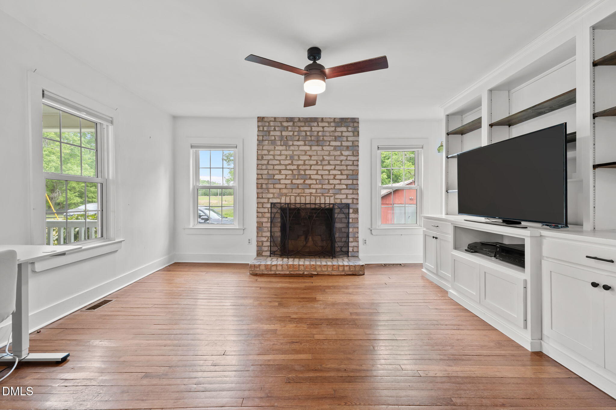 8718 Moody Road Liberty, NC 27298 - Photo 4 of 52 a living room with furniture fireplace and flat screen tv