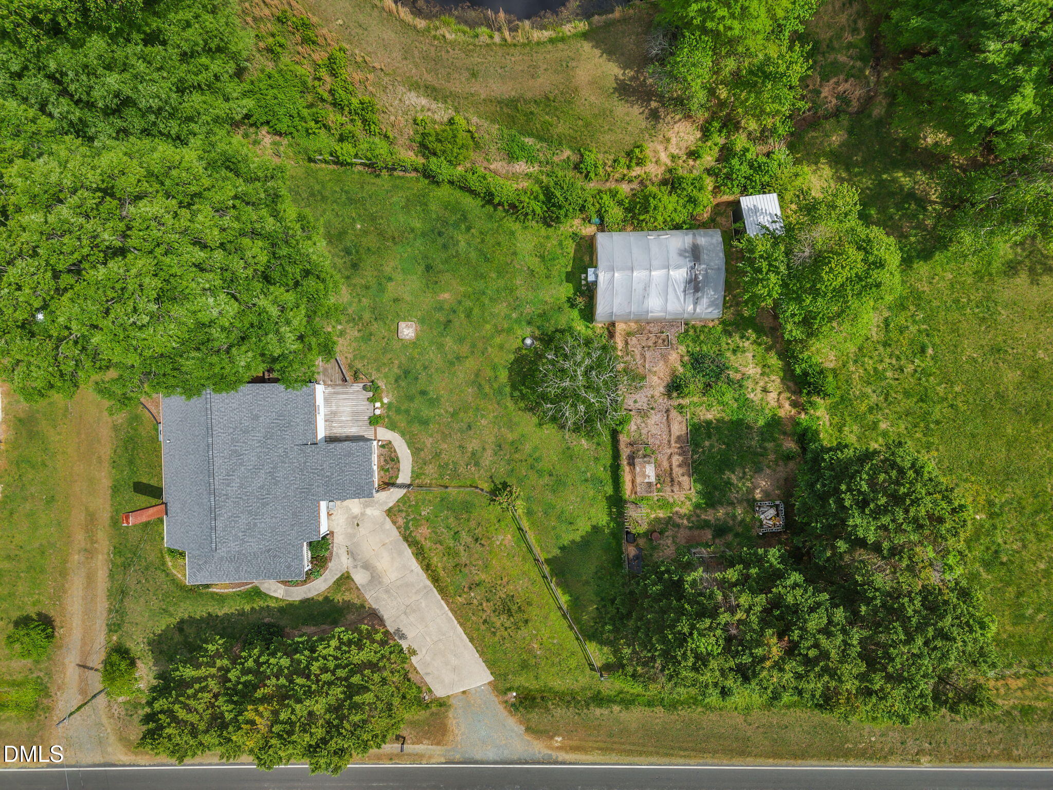8718 Moody Road Liberty, NC 27298 - Photo 48 of 52 an aerial view of a house with yard