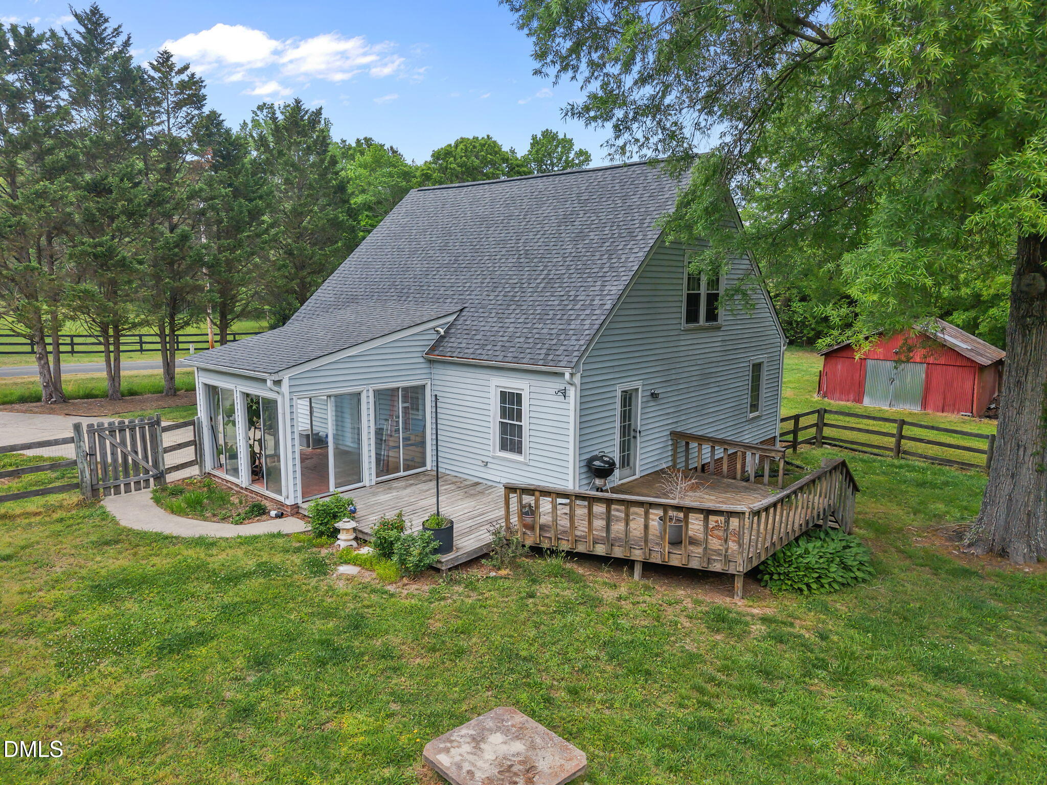 8718 Moody Road Liberty, NC 27298 - Photo 51 of 52 a view of a house with a yard chairs and a patio