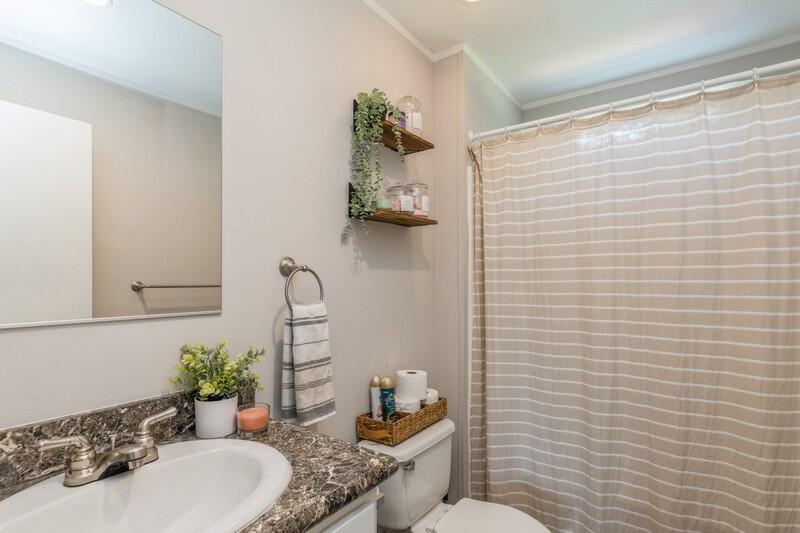 4488 Creek Road Vernon, FL 32462 - Photo 29 of 35 a bathroom with a sink and toilet