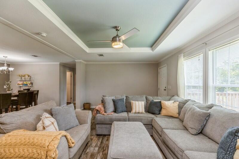 4488 Creek Road Vernon, FL 32462 - Photo 7 of 35 a living room with furniture and a large window