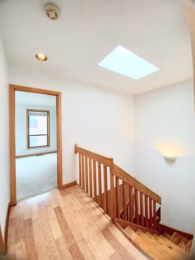 727 South Ashland Avenue, Unit D Chicago, IL 60607 - Photo 15 of 32 a view of a bedroom with wooden floor