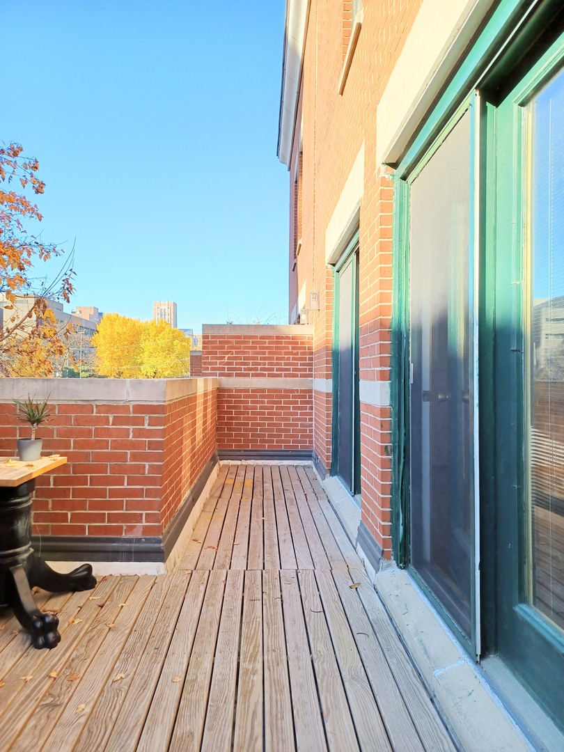 727 South Ashland Avenue, Unit D Chicago, IL 60607 - Photo 25 of 32 a view of balcony with wooden floor