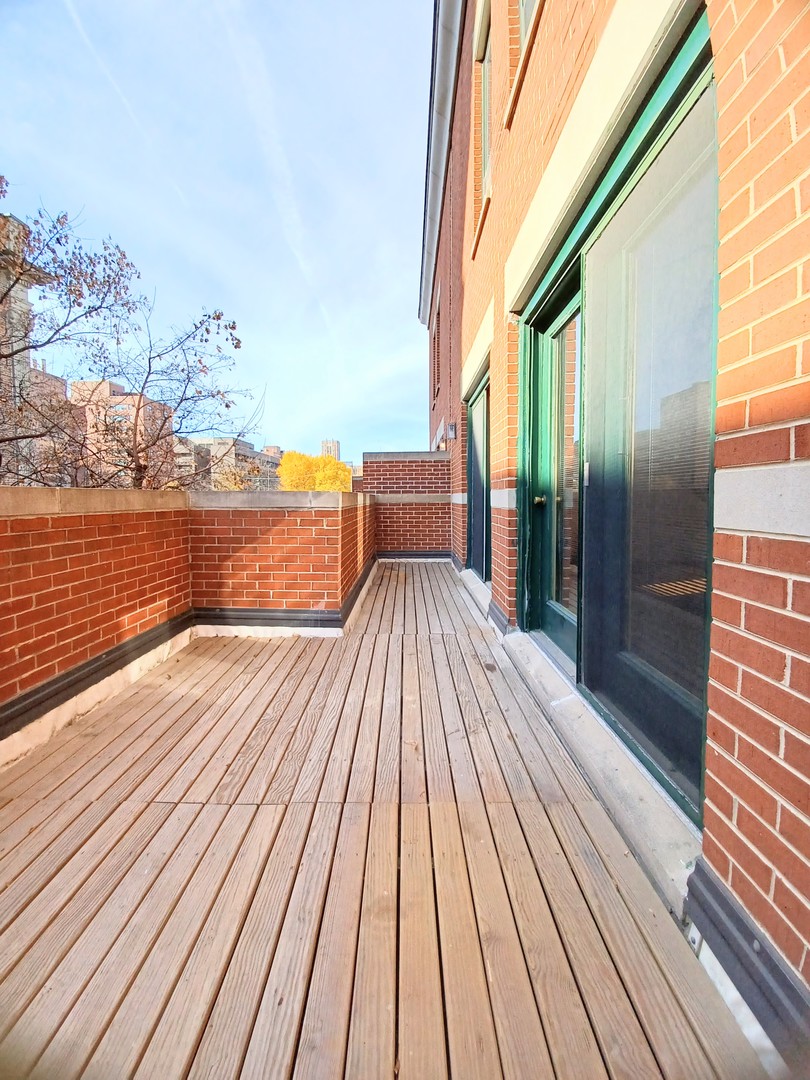 727 South Ashland Avenue, Unit D Chicago, IL 60607 - Photo 27 of 32 a view of balcony with wooden floor