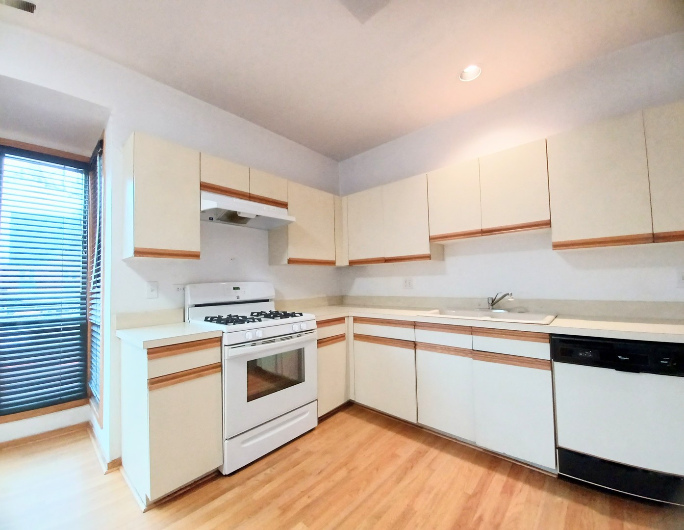 727 South Ashland Avenue, Unit D Chicago, IL 60607 - Photo 10 of 32 a kitchen with a stove white cabinets and white appliances