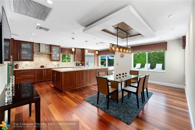 Stunning Kitchen with huge island and custom ceiling details