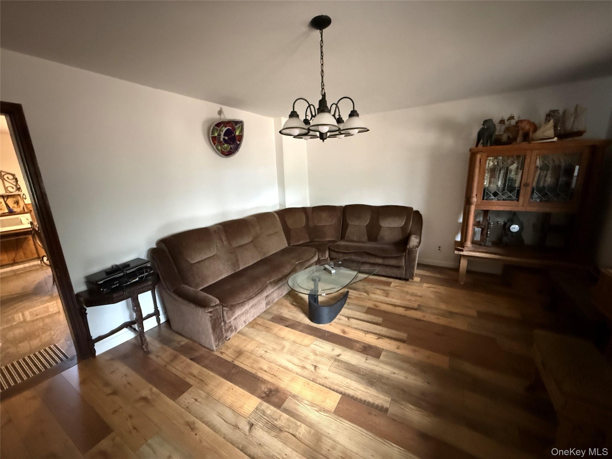 1441 Ulster Heights Road Ellenville, NY 12428 - Photo 15 of 35 a living room with furniture and a wooden floor