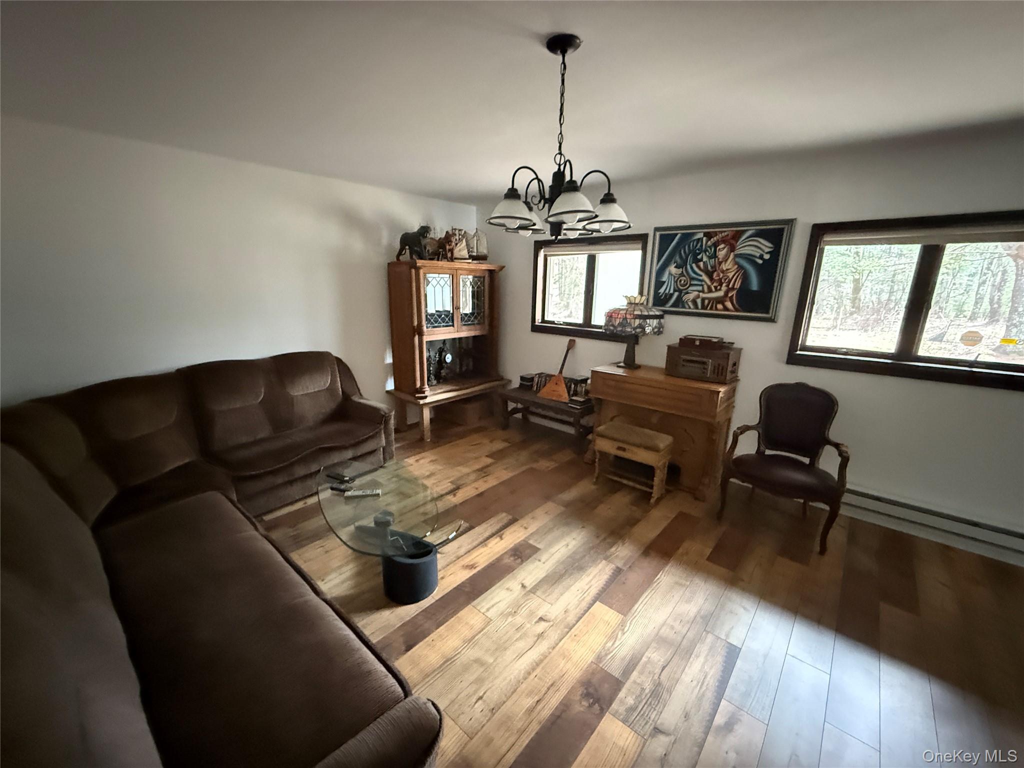 1441 Ulster Heights Road Ellenville, NY 12428 - Photo 16 of 35 a living room with furniture and a window