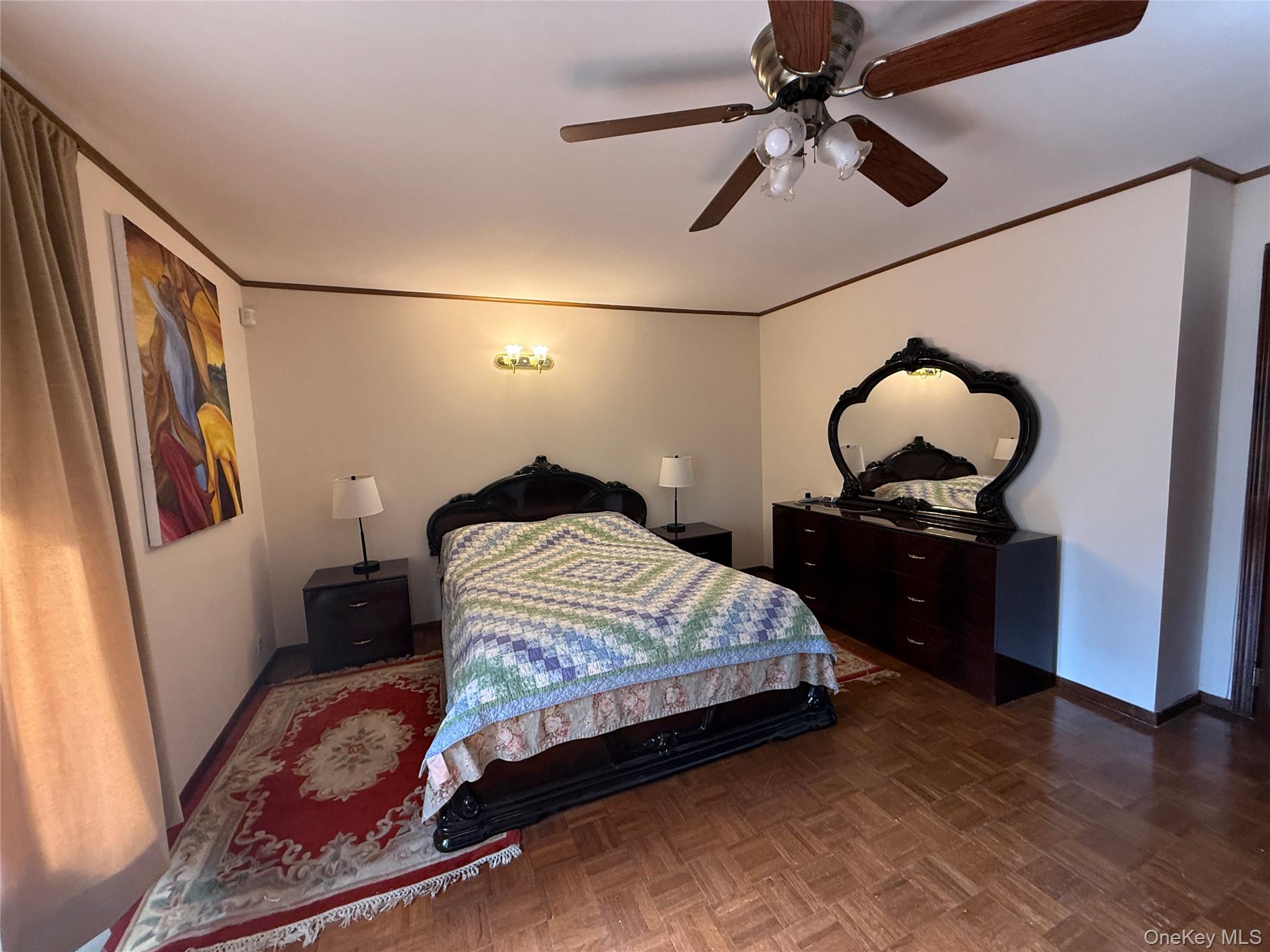 1441 Ulster Heights Road Ellenville, NY 12428 - Photo 27 of 35 a bedroom with a bed and a chandelier