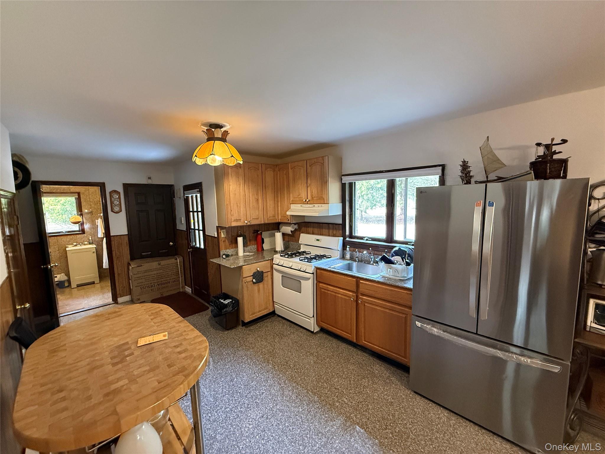 1441 Ulster Heights Road Ellenville, NY 12428 - Photo 3 of 35 a kitchen with refrigerator and window