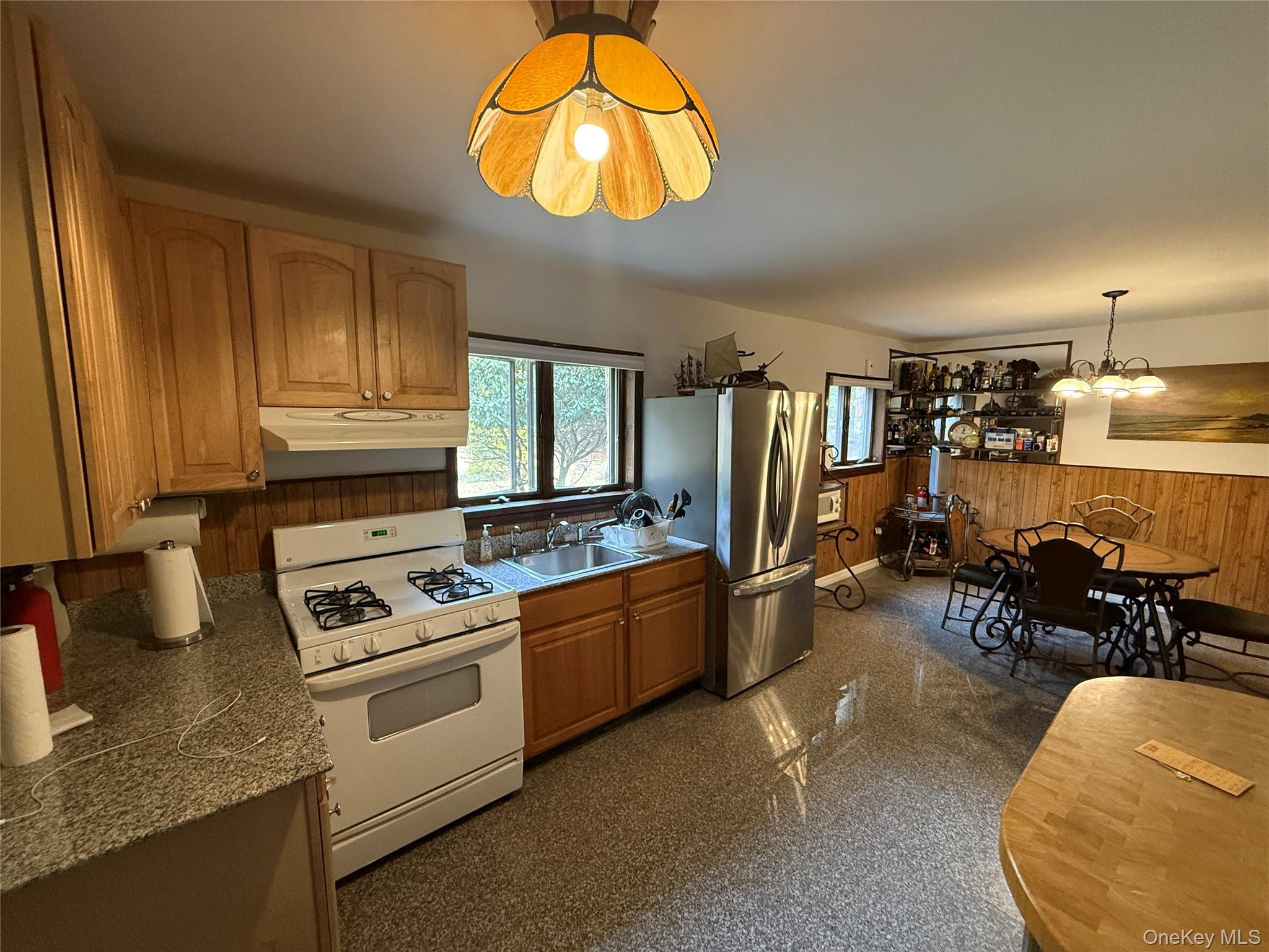 1441 Ulster Heights Road Ellenville, NY 12428 - Photo 7 of 35 a kitchen with stainless steel appliances granite countertop a stove and a sink