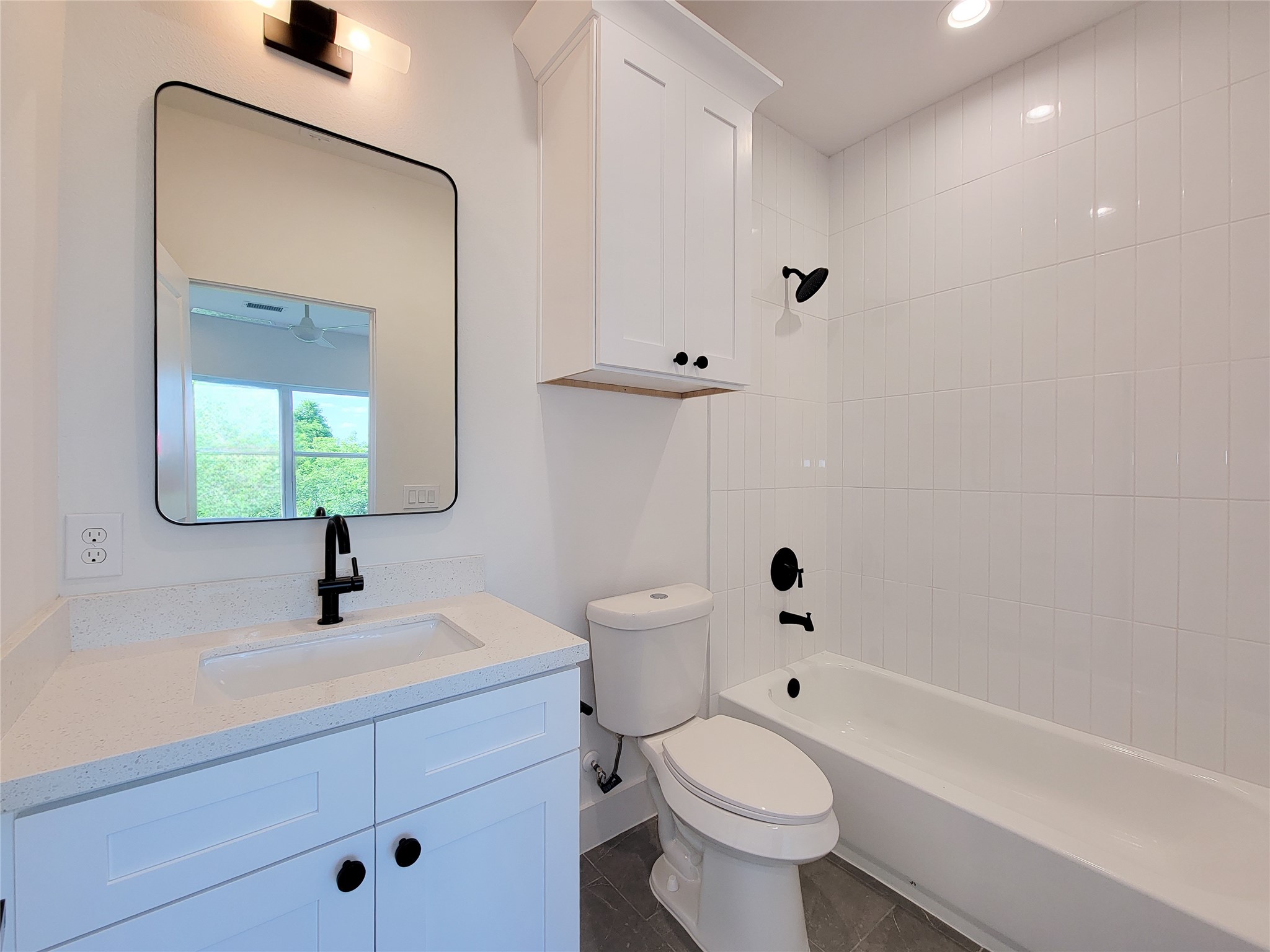 7705 Earl Rudder Way Houston, TX 77055 - Photo 11 of 39 a bathroom with a sink a toilet and shower