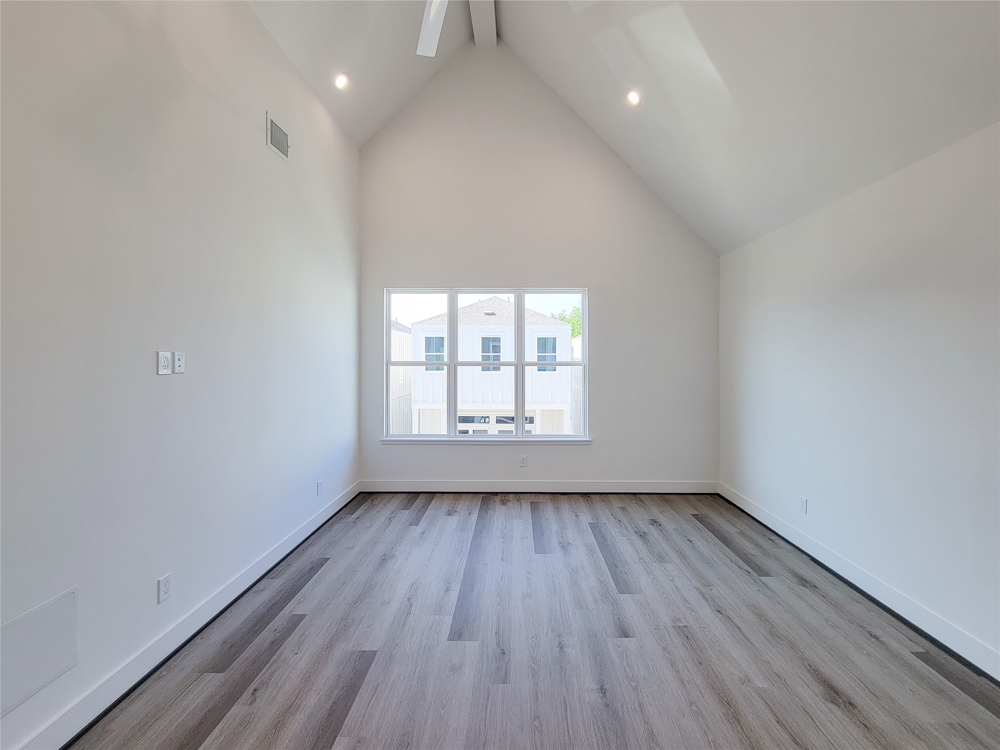7705 Earl Rudder Way Houston, TX 77055 - Photo 14 of 39 wooden floor in an empty room with a window