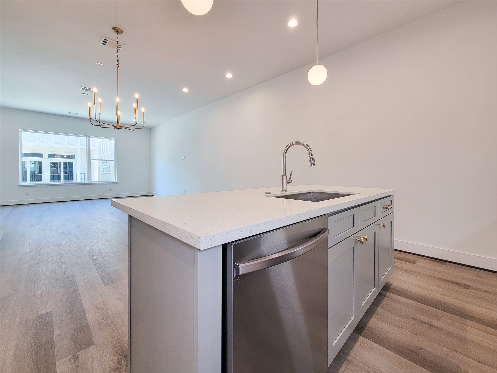 7705 Earl Rudder Way Houston, TX 77055 - Photo 19 of 39 a kitchen that has a sink stainless steel appliances a counter space and a window