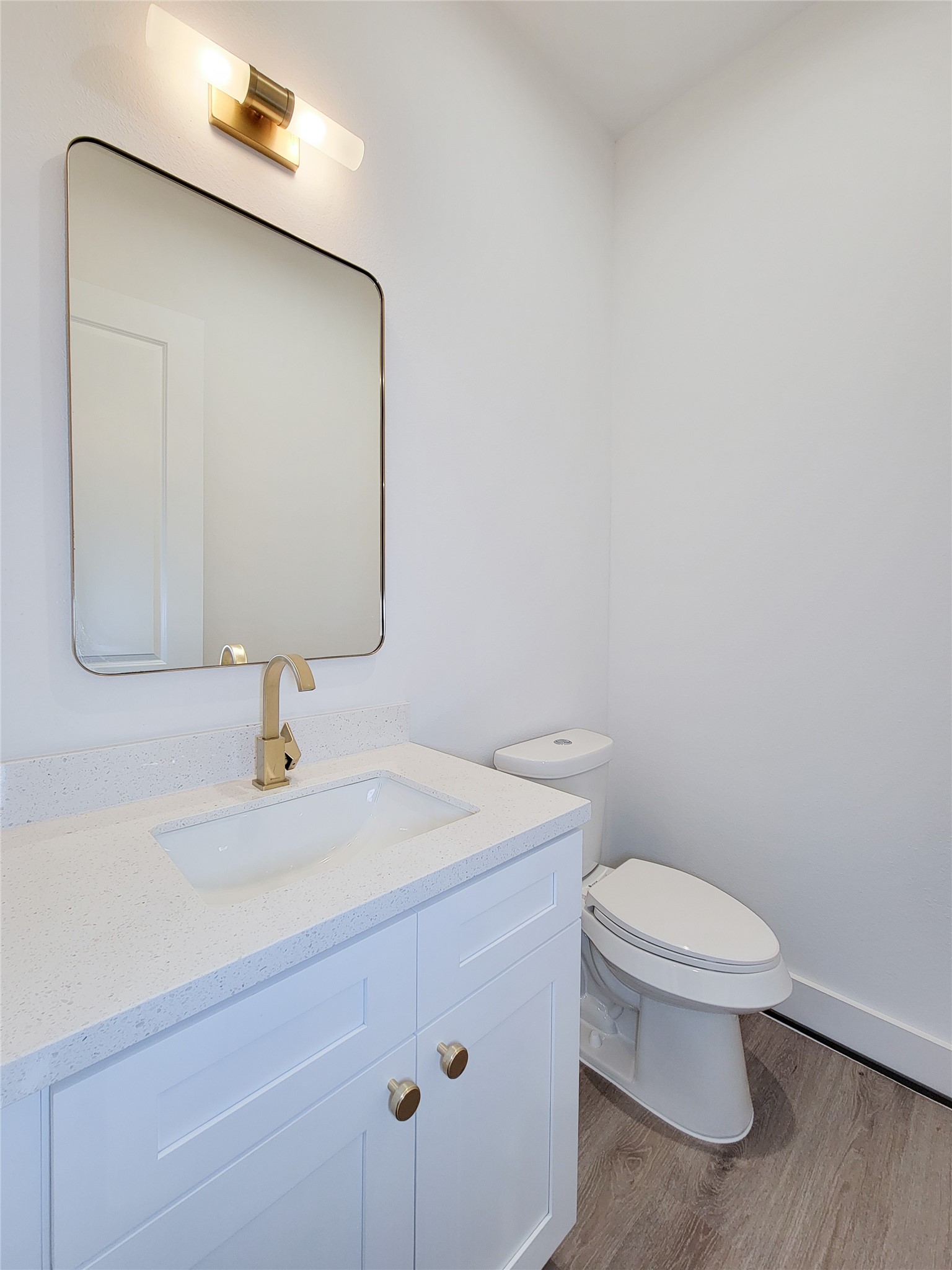 7705 Earl Rudder Way Houston, TX 77055 - Photo 20 of 39 a bathroom with a toilet sink and mirror