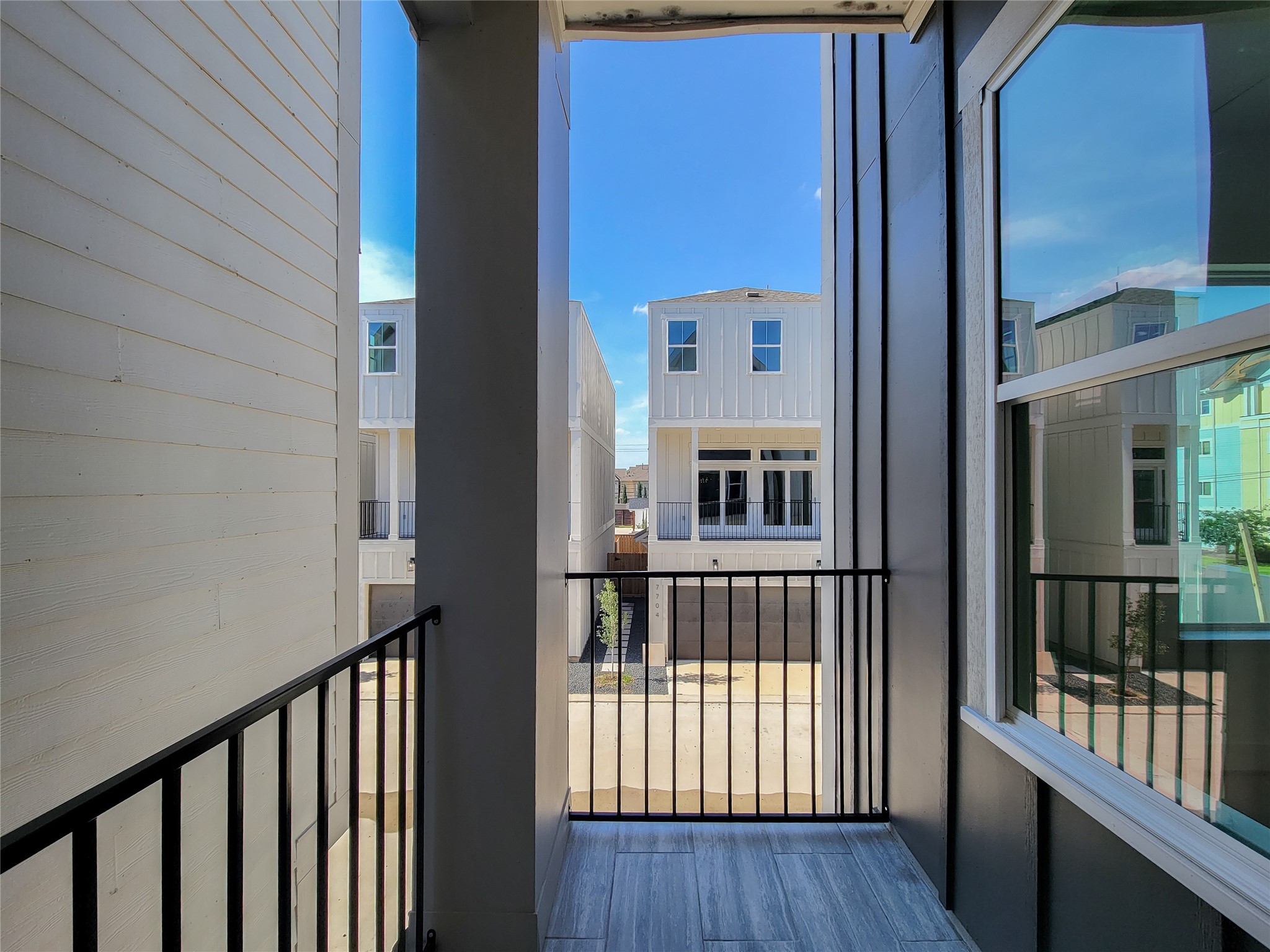 7705 Earl Rudder Way Houston, TX 77055 - Photo 21 of 39 a view of porch with wooden floor