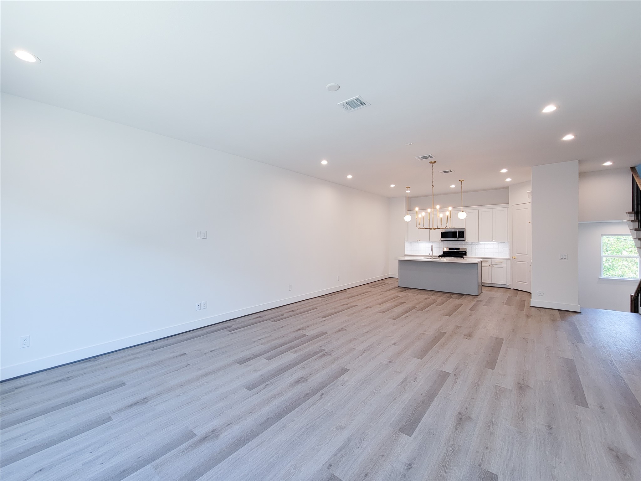 7705 Earl Rudder Way Houston, TX 77055 - Photo 27 of 39 a view of empty room with wooden floor