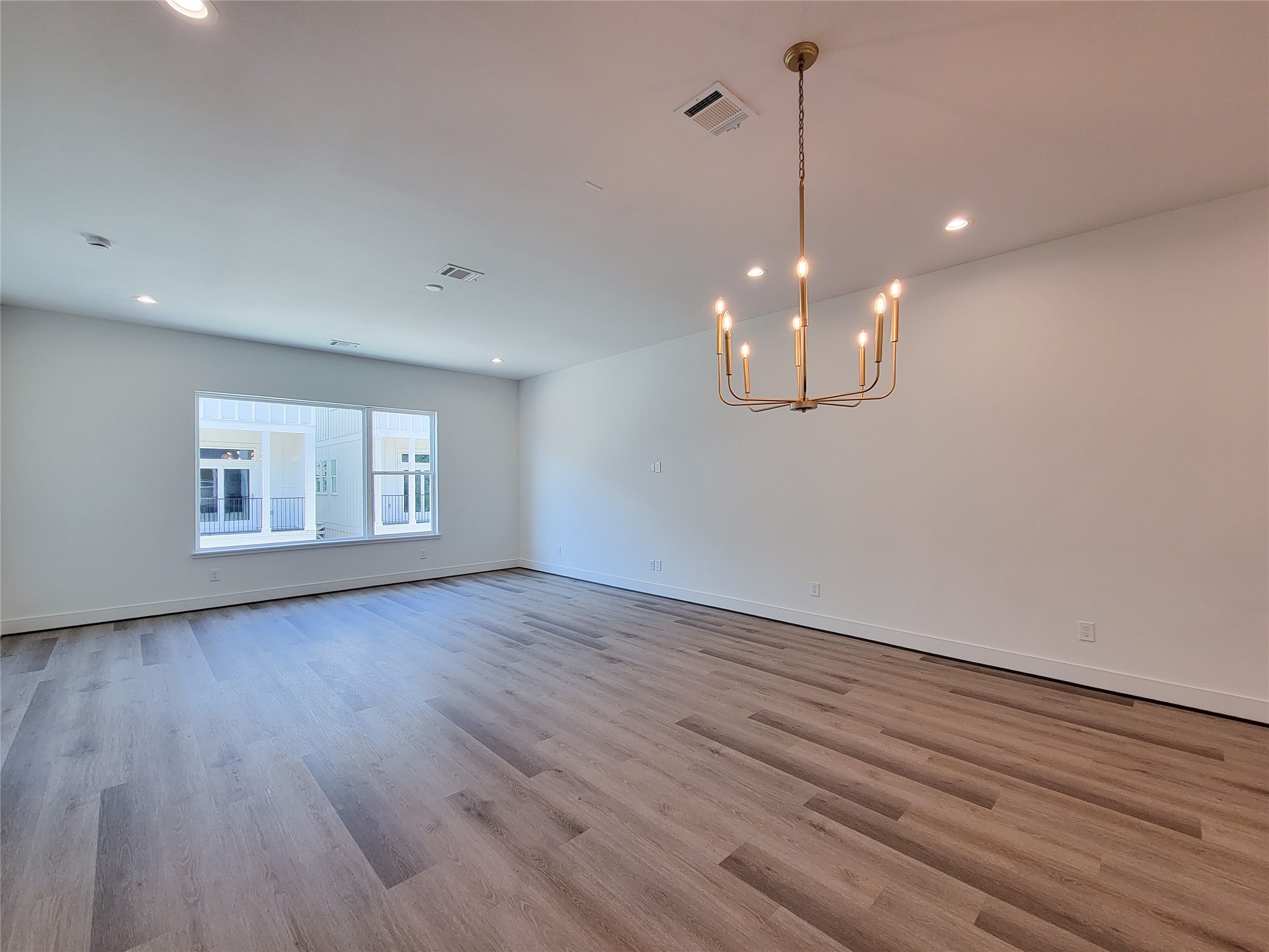 7705 Earl Rudder Way Houston, TX 77055 - Photo 36 of 39 a view of a room with wooden floor and large window