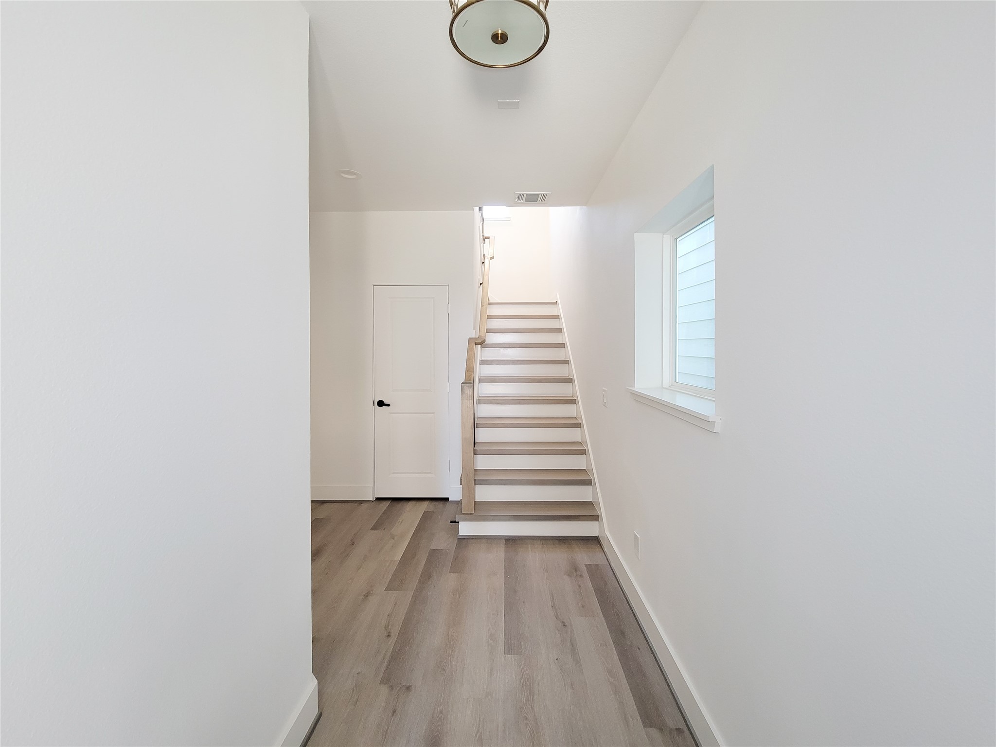 7705 Earl Rudder Way Houston, TX 77055 - Photo 5 of 39 a view of entryway with wooden floor